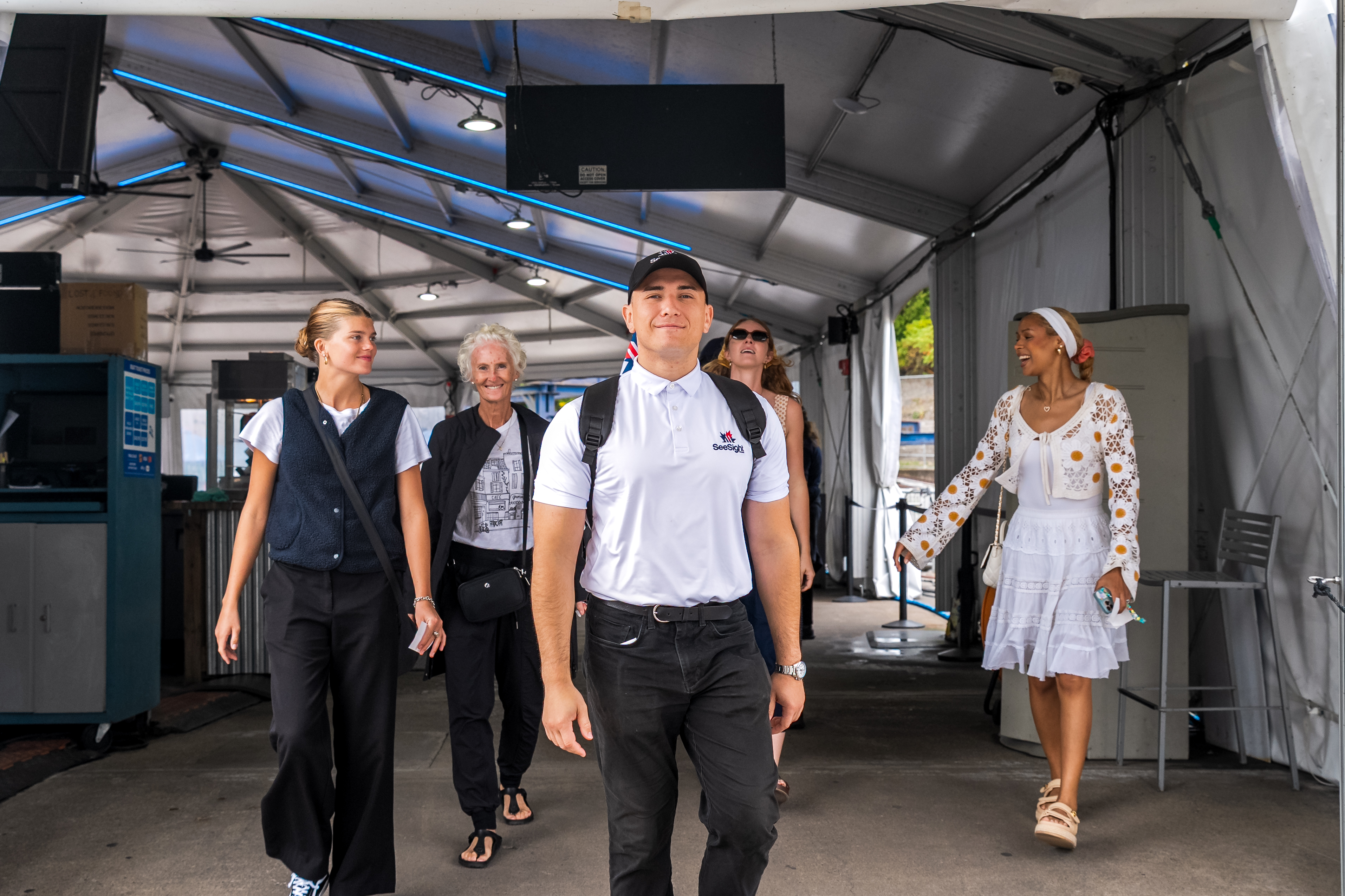 Tour Guide smiling with guests outdoors